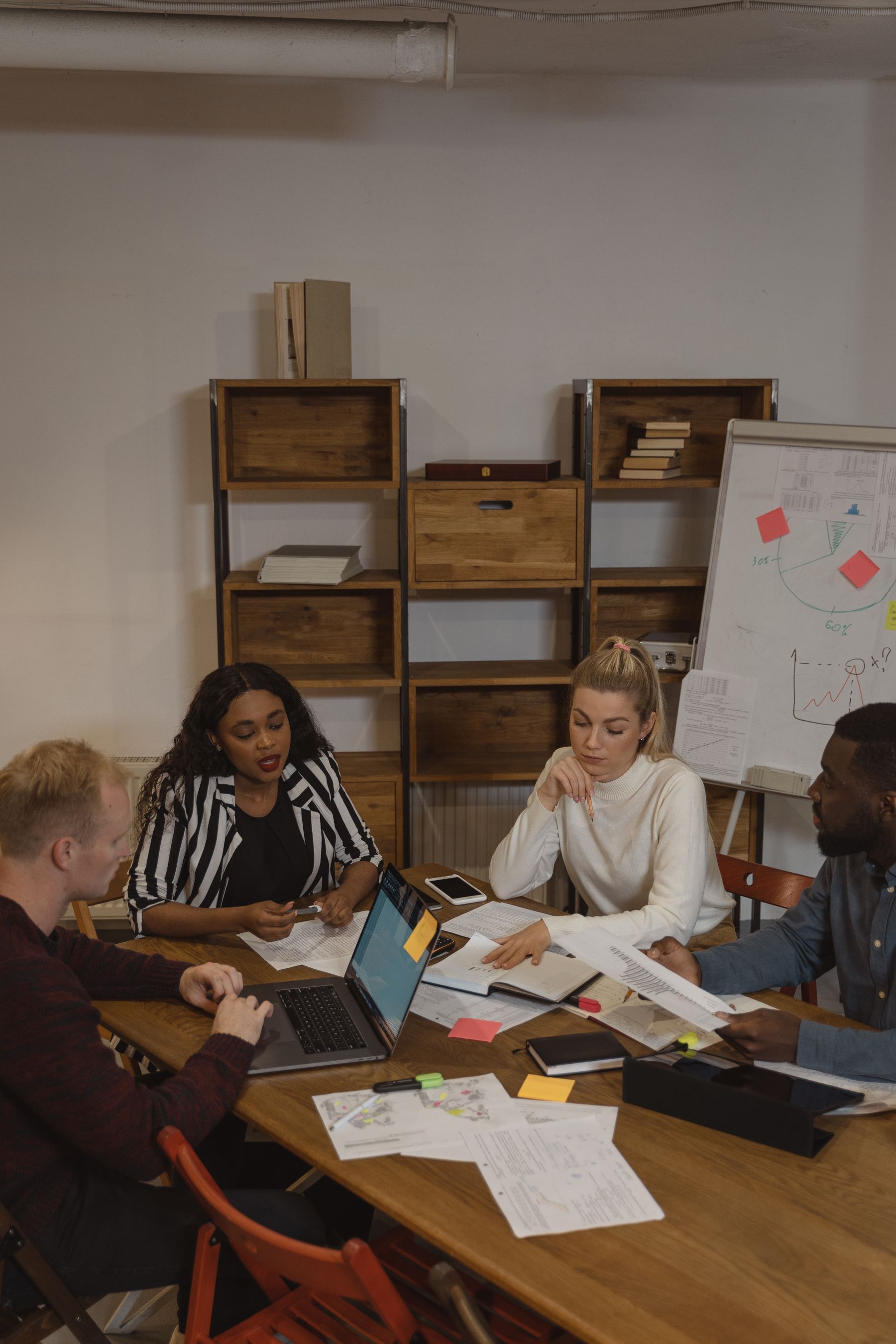 A diverse school support team collaborating around a table
